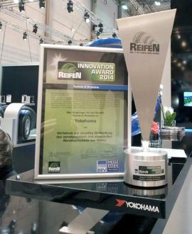 Innovation Award commendation and trophy on display at YOKOHAMA booth at REIFEN 2014