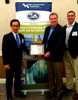 YTMV President Tetsuro Murakami, Director of Environmental Health and Safety Neil Dalton and EHS staff member Christian Yates (left to right) proudly pose with the Environmental Warrior Award.