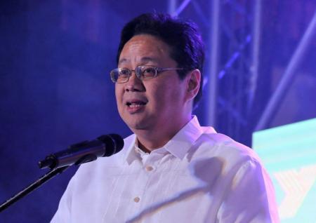 Noel Manankil, President and CEO of Clark Development Corporation, addresses the guests