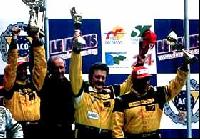 The winning team members and P. Seikel, owner of Seikel Motorsport (second from left). Drivers are, from left, F. Babini, G. Rosa and L. Drudi.
