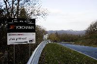 Company logo on a corner sign at the North course