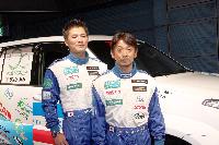 Mr. Ukyo Katayama (right) and Mr. Masahiro Terada, co-driver, in front of their Toyota Land Cruiser