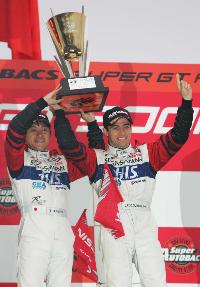 Drivers Seiji Ara and Joao Paulo de Oliveira in Victory Lane