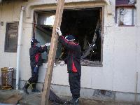 Removing debris from a building