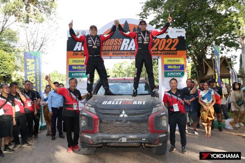 Team Mitsubishi Ralliart celebrates after winning overall championship